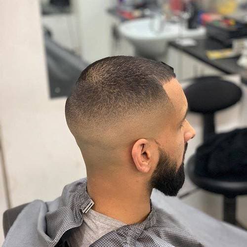 Faded haircut with crisp detailing at Cutz
